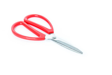 red scissors cutting on white background