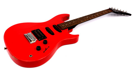 Obraz na płótnie Canvas Red electric guitar with white backdrop.