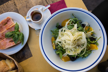 Fennel, olive, rocket and orange salad with fresh bruschetta and a short black coffee in Rome, Italy