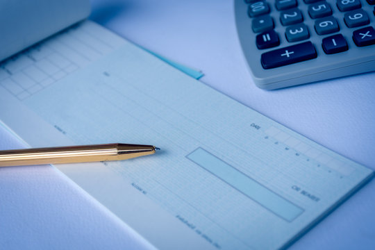 Mock Up Image Of Cheque Book , Pen And Calculator On White Background