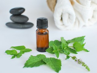 Peppermint essential oil for massage, towels and zen stones.