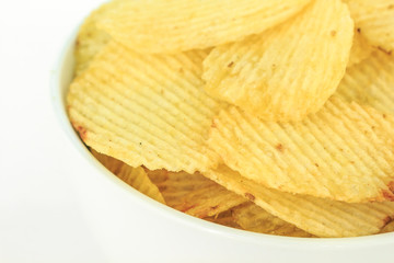 crispy potato chips junk food unhealthy food on bowl white background