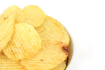 crispy potato chips junk food unhealthy food on bowl white background