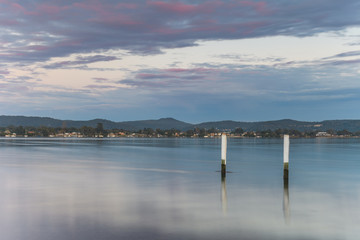 Cloudy Reverse Sunrise Waterscape over the Bay