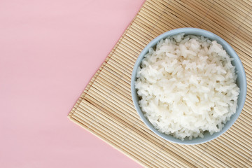 rice in bowl on pink background rose quartz