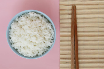 rice in bowl on pink background rose quartz