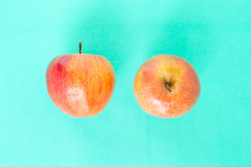 red apple top focus on green background