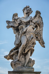 Fototapeta na wymiar Angel with the superscription sculpture by Gian Lorenzo Bernini on the Pont Sant'Angelo bridge in Rome