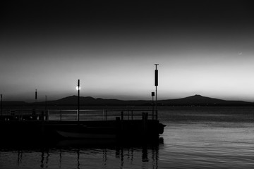 A pier at Trasimeno lake (Umbria, Italy) at dusk