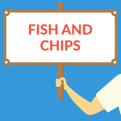 FISH AND CHIPS. Hand holding wooden sign