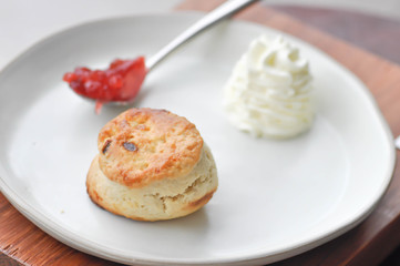 scone with whippied cream and jam