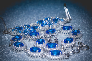 Silver bracelet and earring with tanzanite