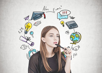Pensive young woman with pen, education