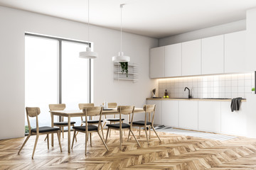 Gray chairs in a white kitchen corner