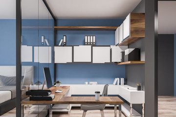 Home office in blue bedroom, front view
