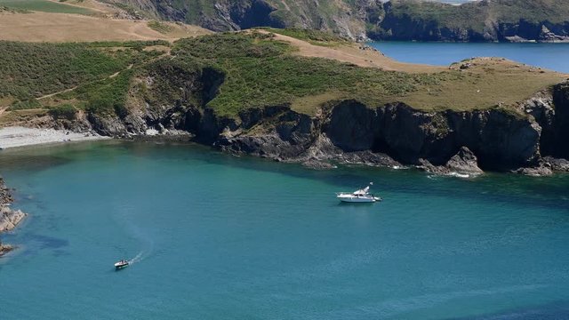 Looking down towards a white moter cruiser moored off Solva Pembrokeshire