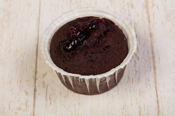 Tasty muffin over wooden