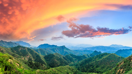 Green mountains and beautiful sky at sunset