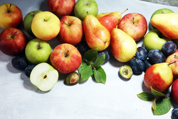 Various fresh fruits. Thanksgiving apples, and pears on rustic background.