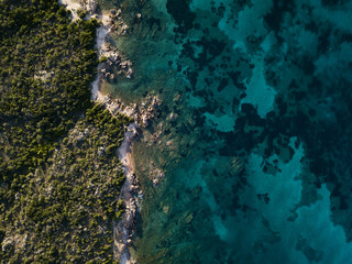View from above, aerial view of a rocky coast bathed by an emerald and transparent Mediterranean sea,Sardinia, Italy