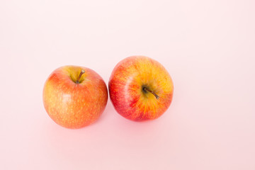 red apple on pink background