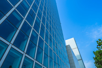 Modern office building against blue sky.