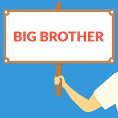 BIG BROTHER. Hand holding wooden sign