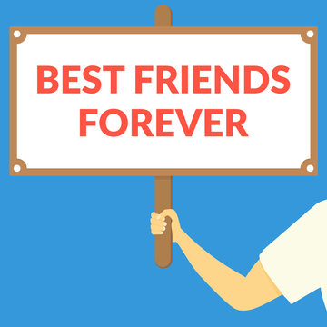 BEST FRIENDS FOREVER. Hand holding wooden sign