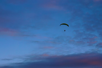 Paragliding with blue sky background