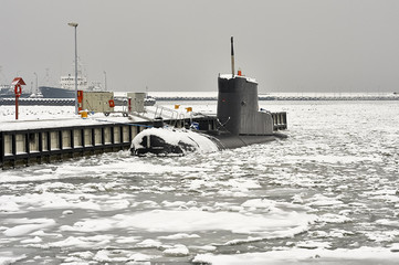 Small submarine in the winter port