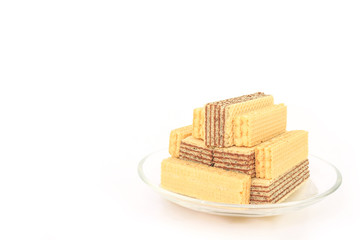 wafer chocolate milk dessert  on glass plate on white background