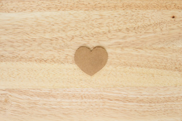 Fototapeta na wymiar valentine paper heart on wood background
