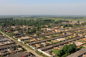 from a height overlooking the small cottage in a town
