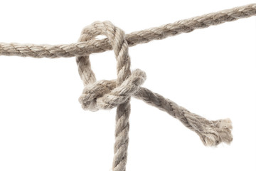 Close-up of a rope knot, isolated on white background