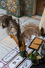 desk and tools of arabic calligrapher, marrakech, morocco