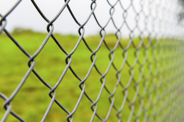 Fototapeta premium Steel fence around the field