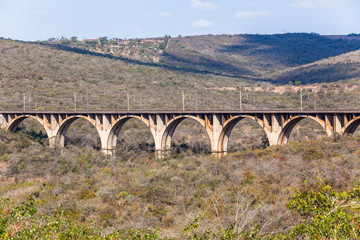 Fototapeta na wymiar Railway Train Arched Bridge Vintage Landscape
