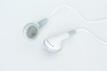 earbuds or earphones on white background