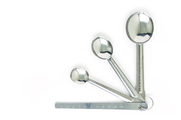 measuring spoons chrome on white background