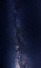 Milky Way Galaxy with stars and space dusts. soft focus and noise due to long expose and high iso.