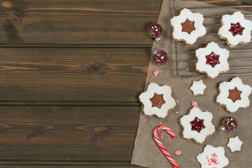 Homebaked Christmas Star Cookies With Chocolate, Cherry Jam, Icing Sugar.