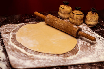 Roll out dough with rolling pin. Making bread. Cooking Process Concept 