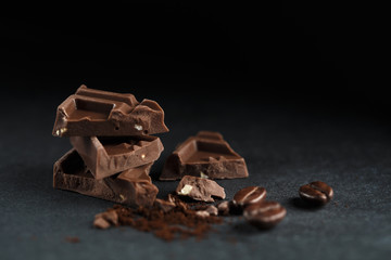 Chocolate pieces on dark background