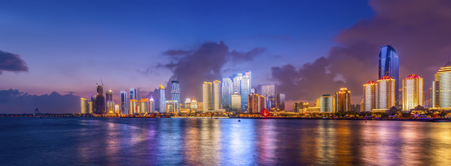 Fototapeta premium The night scene of modern urban architectural landscape in Qingdao, China