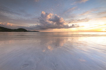 sunset seascape with reflection. soft focus due to long expose.