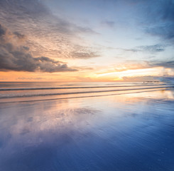 sunset seascape with reflection. soft focus due to long expose.