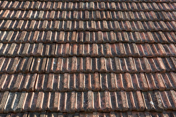 Old red roof tiles as background, wallpaper