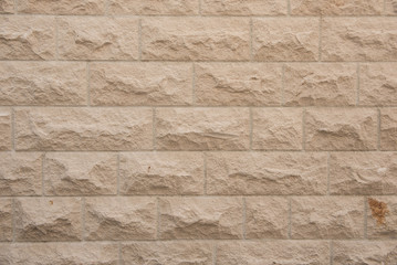 Beige stone wall as background