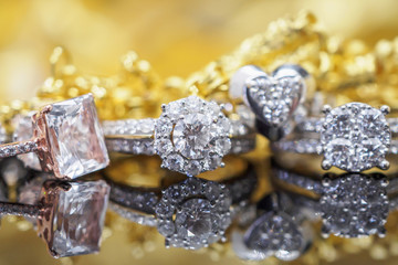 Luxury gold Jewelry diamond rings with reflection on black background