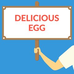 DELICIOUS EGG. Hand holding wooden sign